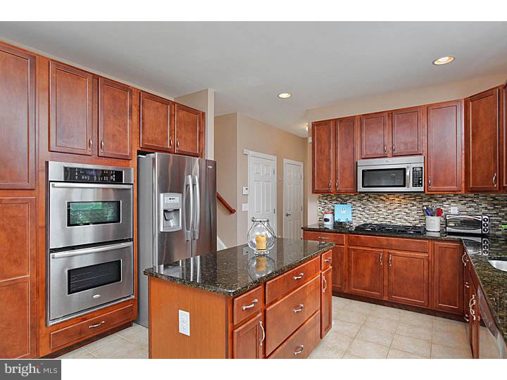 830 Derius Drive Mickleton, NJ 08056 - Photo 3 of 24 a kitchen with stainless steel appliances granite countertop a refrigerator stove top oven and sink
