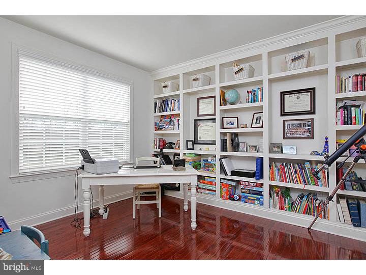 830 Derius Drive Mickleton, NJ 08056 - Photo 5 of 24 a view of a workspace with furniture and a bookshelf
