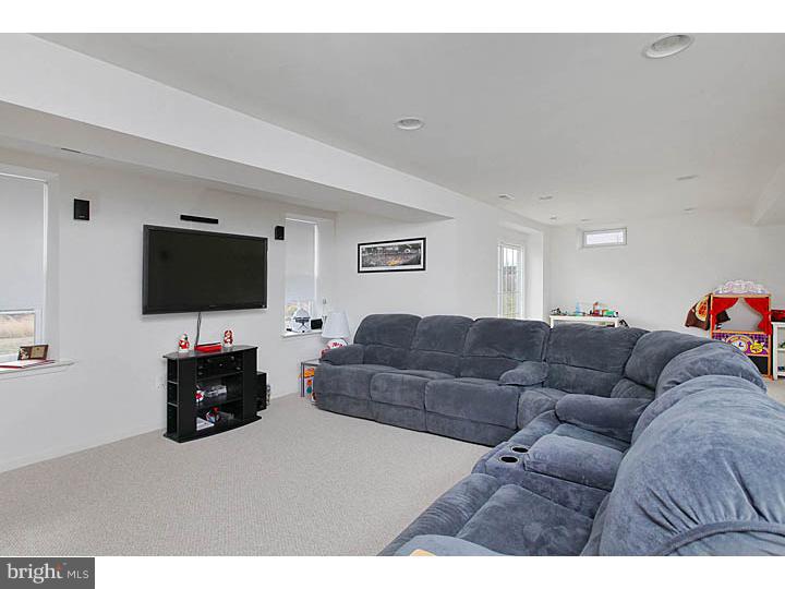 830 Derius Drive Mickleton, NJ 08056 - Photo 6 of 24 a living room with furniture and a flat screen tv