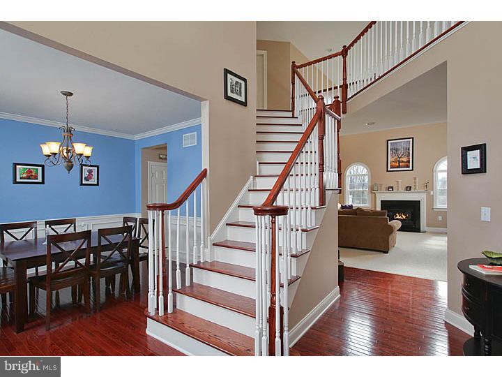 830 Derius Drive Mickleton, NJ 08056 - Photo 7 of 24 a view of entryway dining room and hall with wooden floor