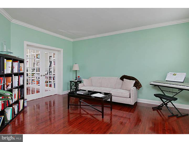 830 Derius Drive Mickleton, NJ 08056 - Photo 8 of 24 a living room with furniture and a book shelf