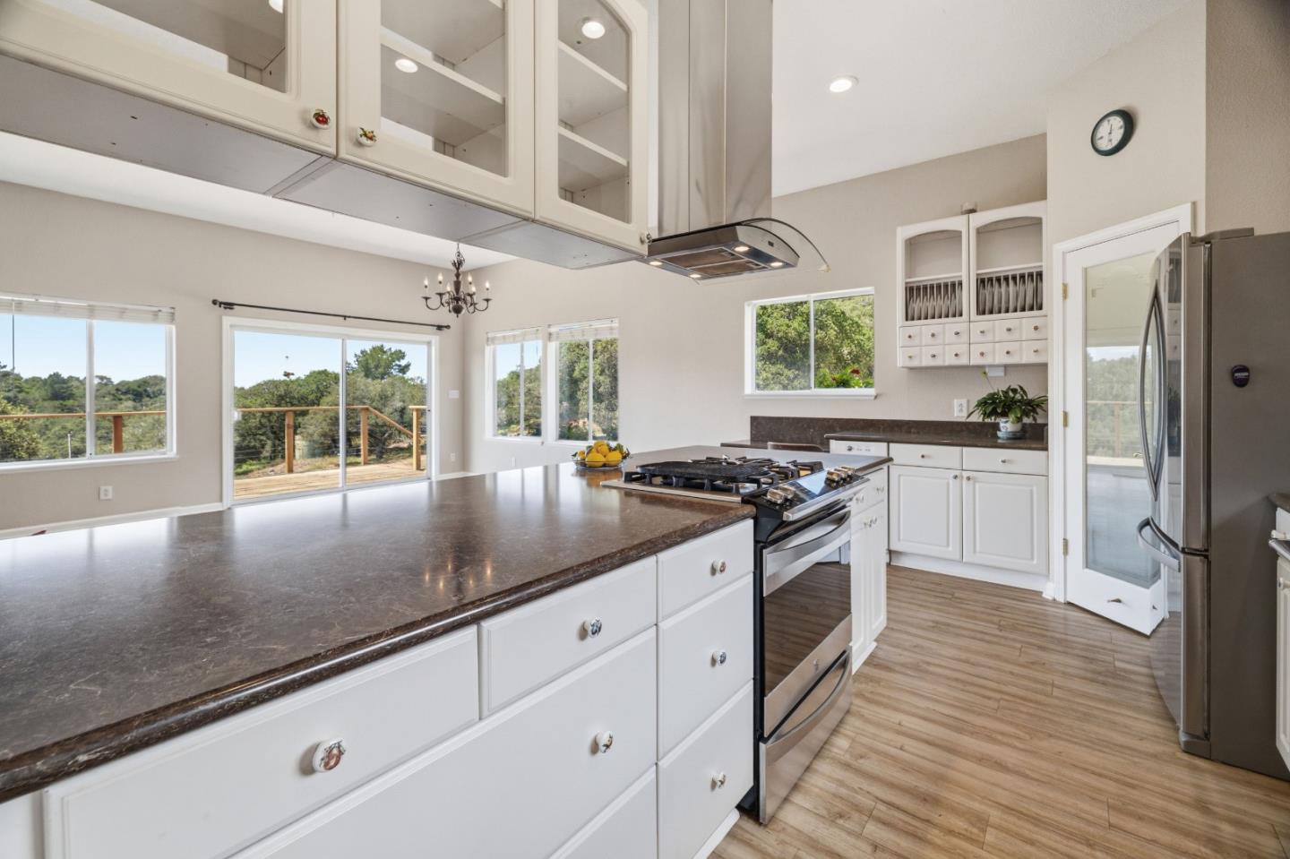 19269 Mallory Canyon Road, Unit D Salinas, CA 93907 - Photo 13 of 77 a kitchen with stainless steel appliances granite countertop a stove a sink and a refrigerator
