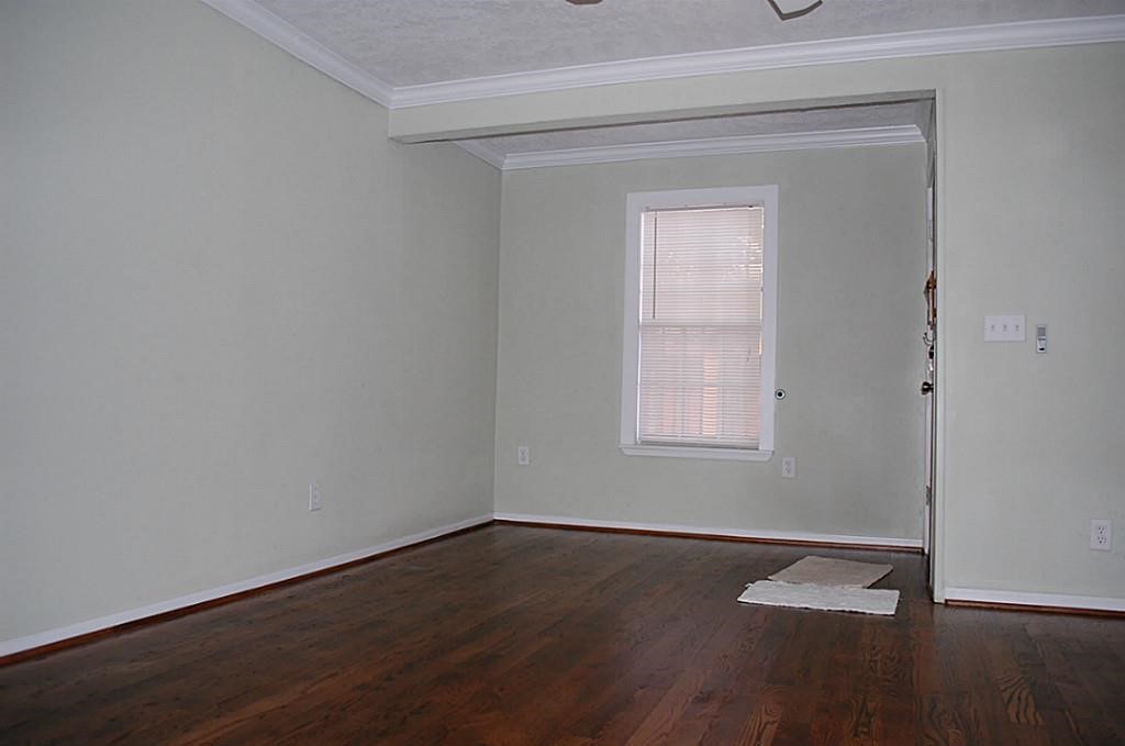 3804 Garrow Street Houston, TX 77003 - Photo 16 of 22 a view of a small space with wooden floor and a window