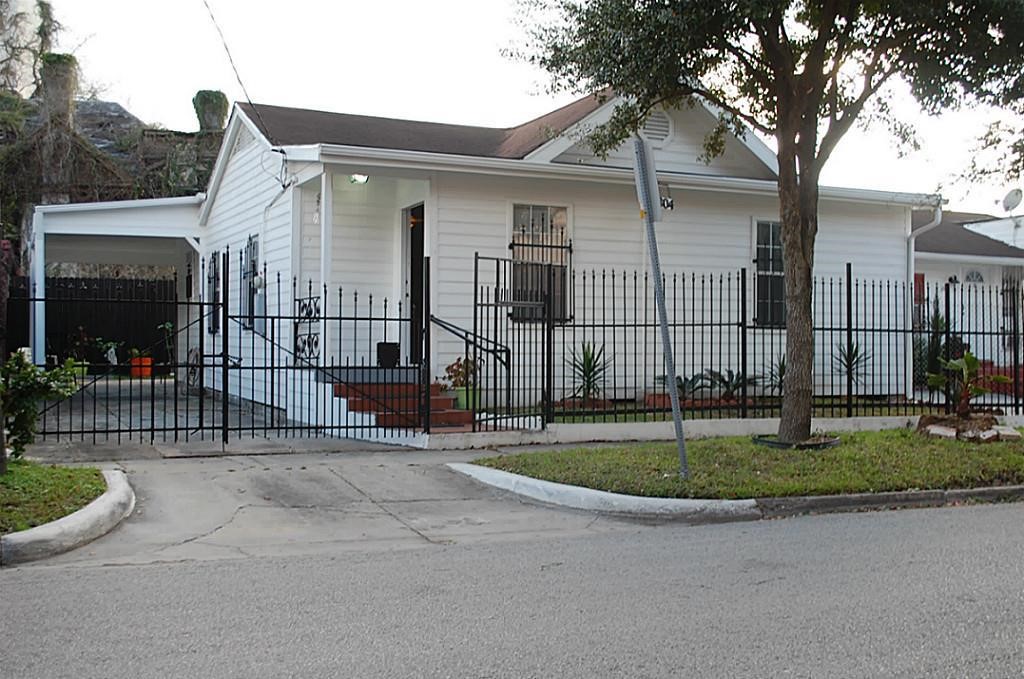 3804 Garrow Street Houston, TX 77003 - Photo 2 of 22 a view of a house with a small yard and plants