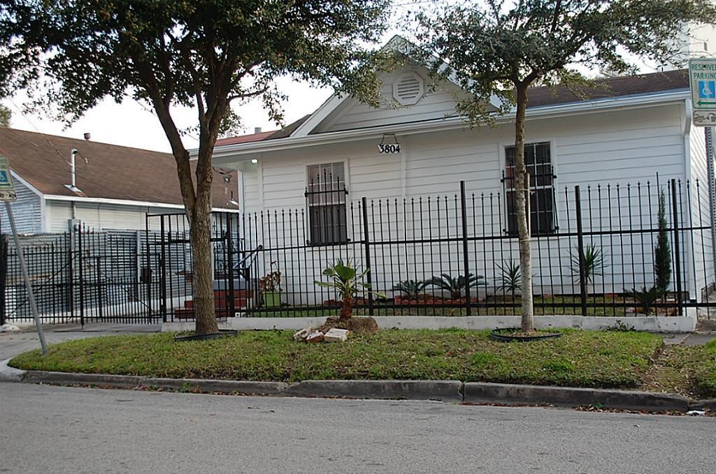 3804 Garrow Street Houston, TX 77003 - Photo 3 of 22 a view of a house with a small yard and plants
