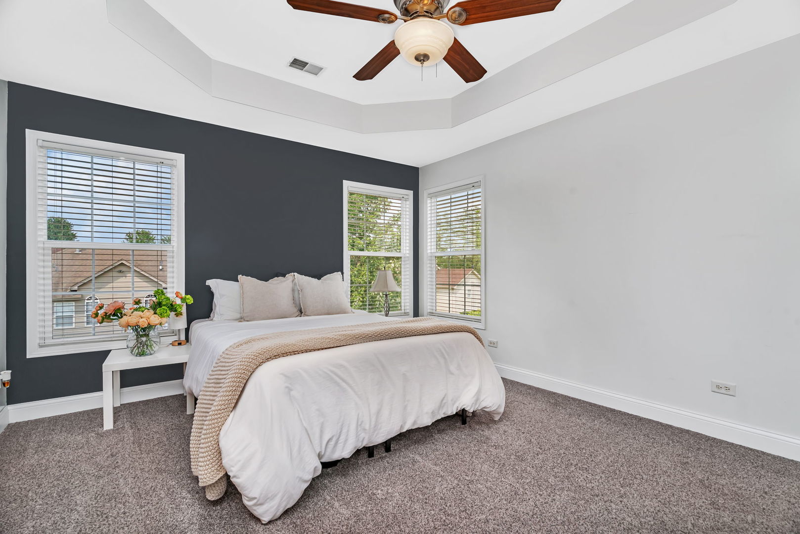 1110 Sandstone Drive Diamond, IL 60416 - Photo 21 of 49 a bed sitting in a bedroom next to a window