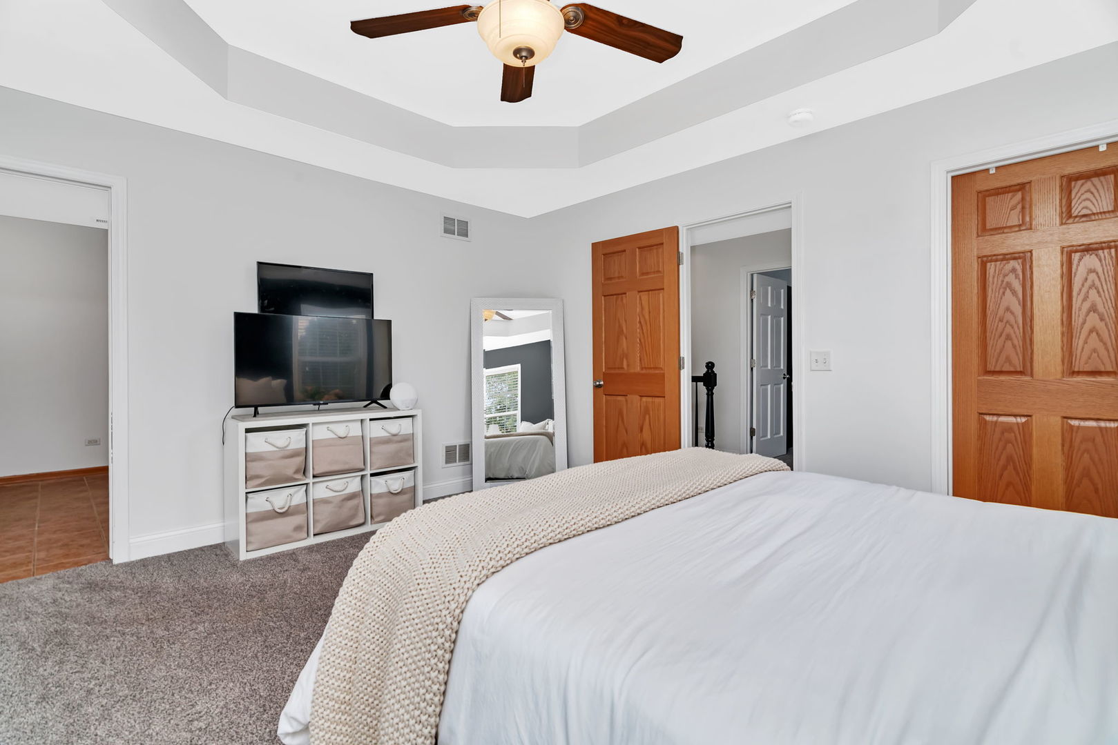 1110 Sandstone Drive Diamond, IL 60416 - Photo 22 of 49 a bedroom with a bed and a flat screen tv