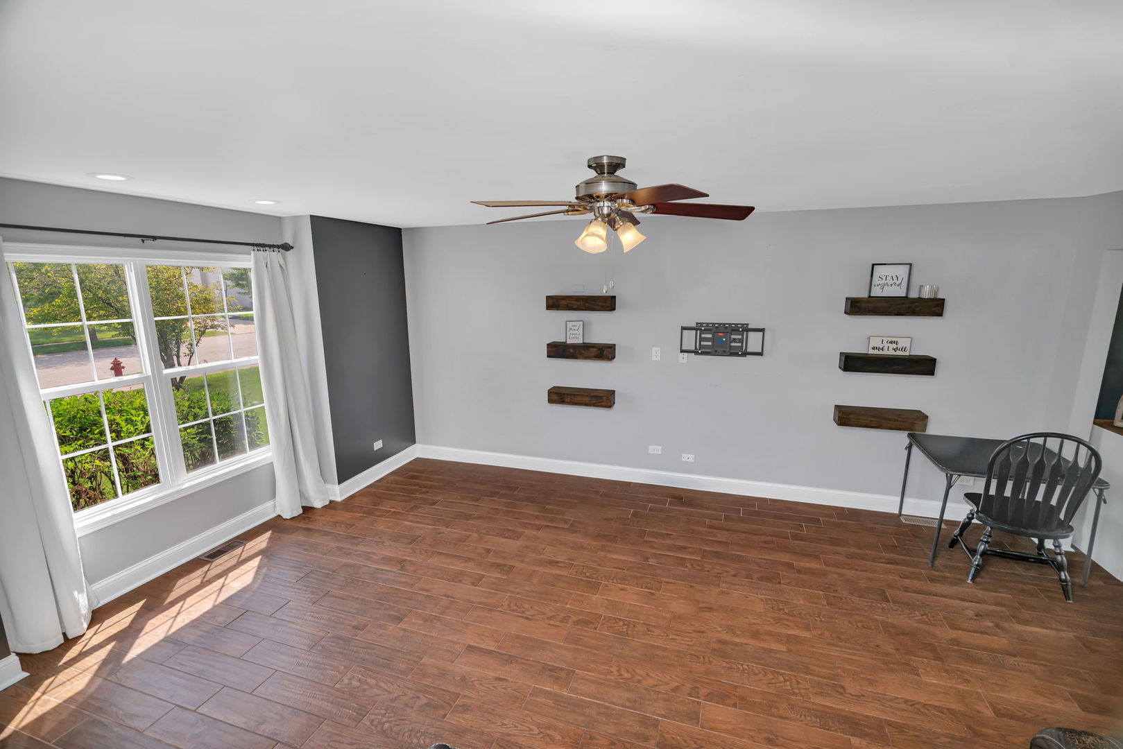 1110 Sandstone Drive Diamond, IL 60416 - Photo 4 of 49 a view of an empty room with a window