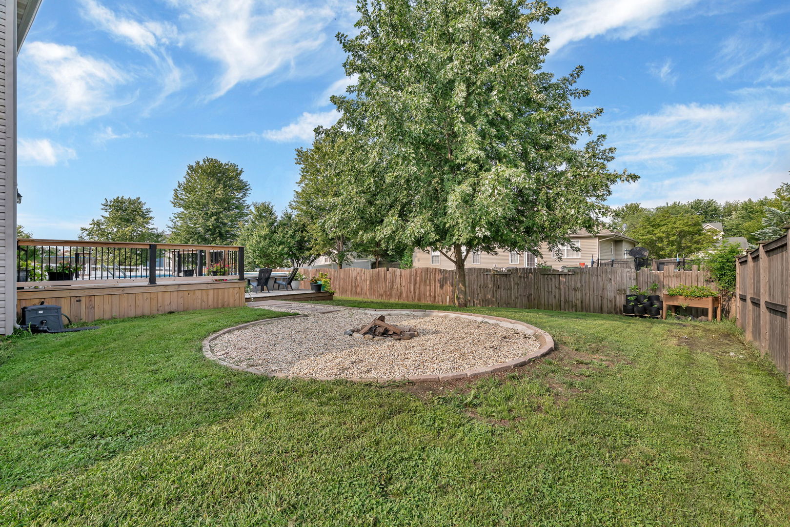 1110 Sandstone Drive Diamond, IL 60416 - Photo 42 of 49 a backyard of a house with table and chairs