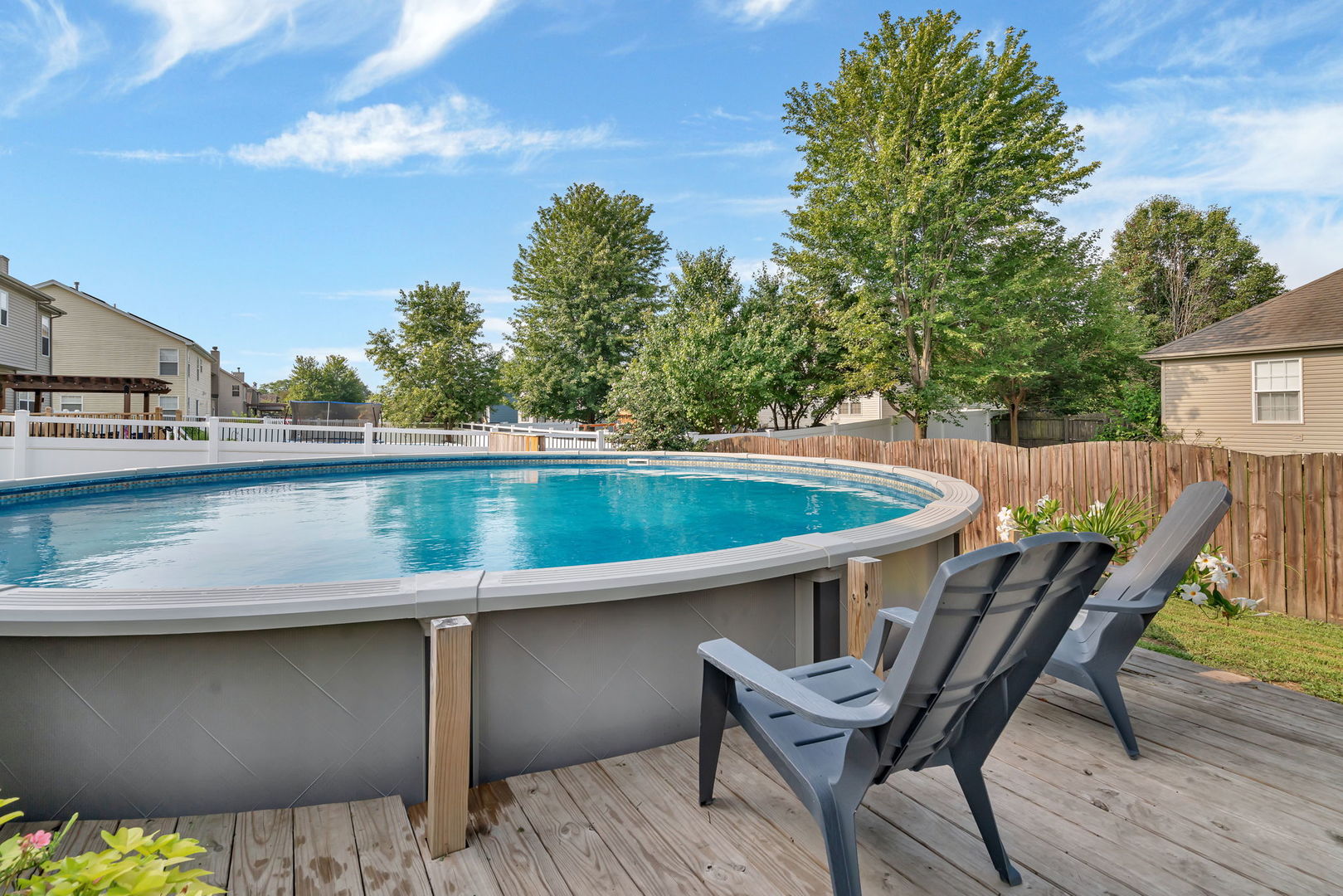 1110 Sandstone Drive Diamond, IL 60416 - Photo 43 of 49 a roof deck with table and chairs and wooden floor