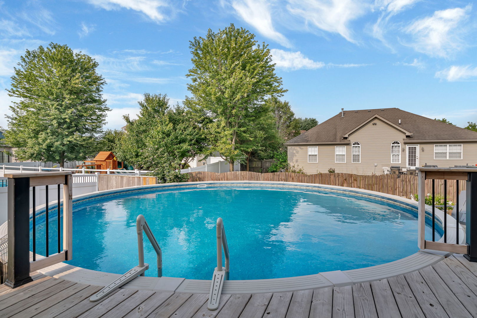1110 Sandstone Drive Diamond, IL 60416 - Photo 45 of 49 a view of a wooden deck and a backyard