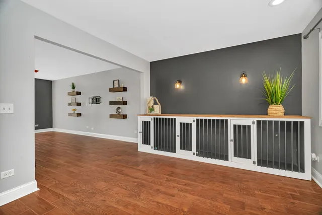 a view of a livingroom with wooden floor and a window