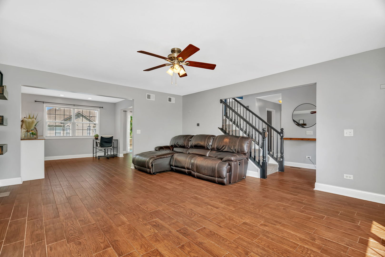 1110 Sandstone Drive Diamond, IL 60416 - Photo 10 of 49 a living room with furniture and a wooden floor