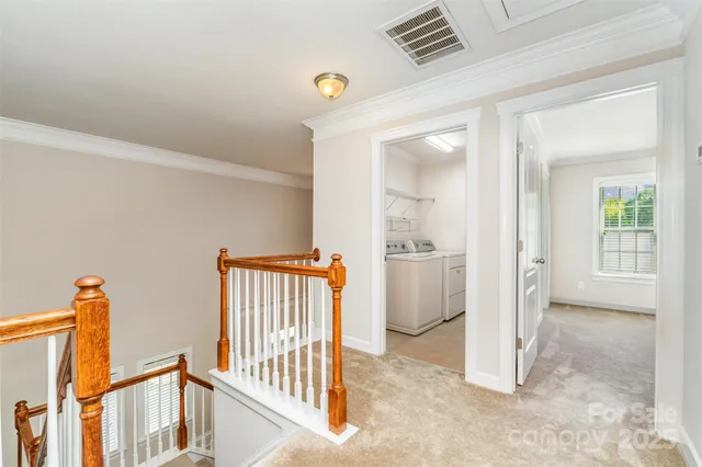 a spacious bedroom with a bed and glass window