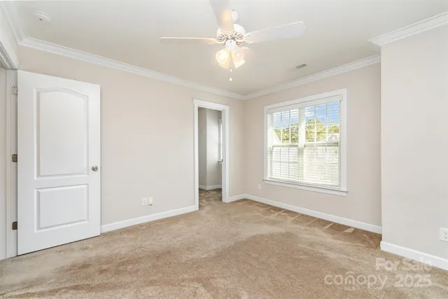 a bathroom with a sink a toilet and a large mirror