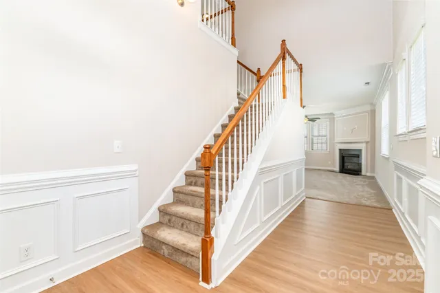a view of entryway and hall with wooden floor