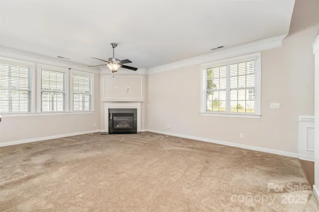a view of a room with window and wooden floor