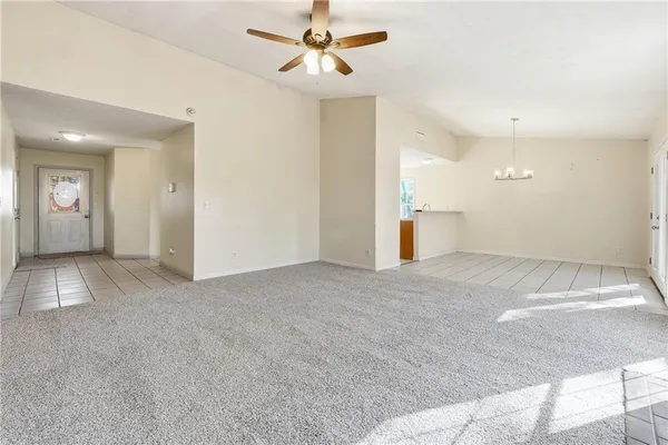 a view of a big room with closet and windows