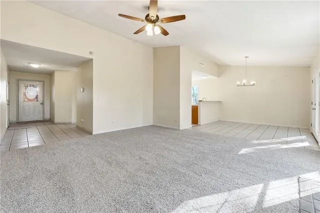 a view of a big room with closet and windows