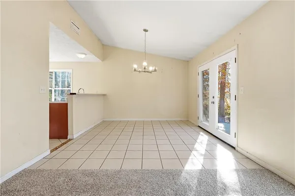 a view of an empty room and window