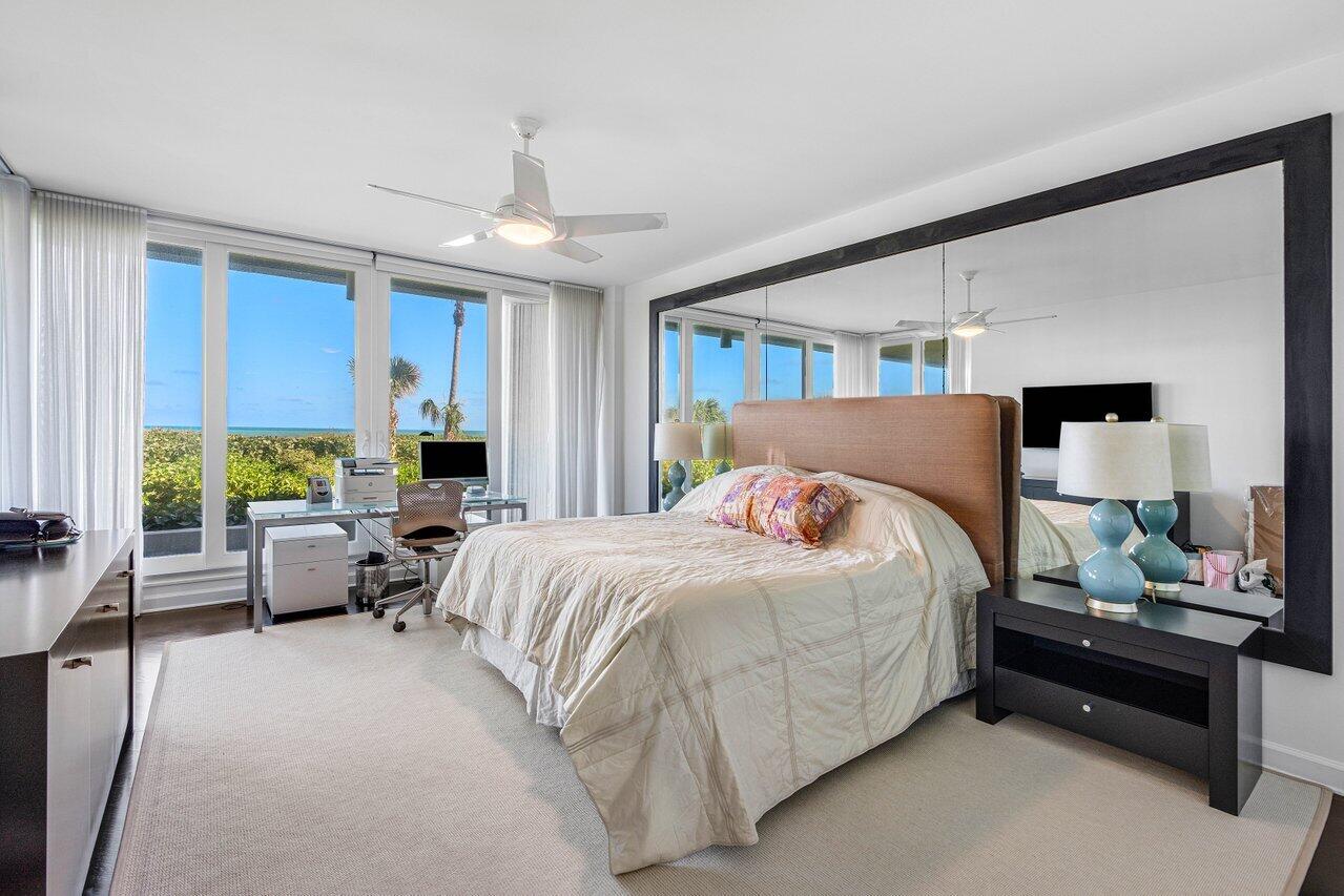 3001 Southeast Island Point Lane, Unit 12 Stuart, FL 34996 - Photo 15 of 44 a bedroom with a bed and a couch