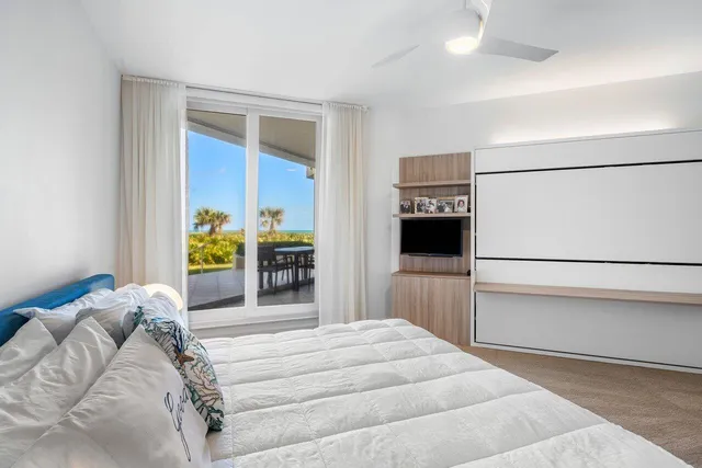 a bed room with a bed and a window