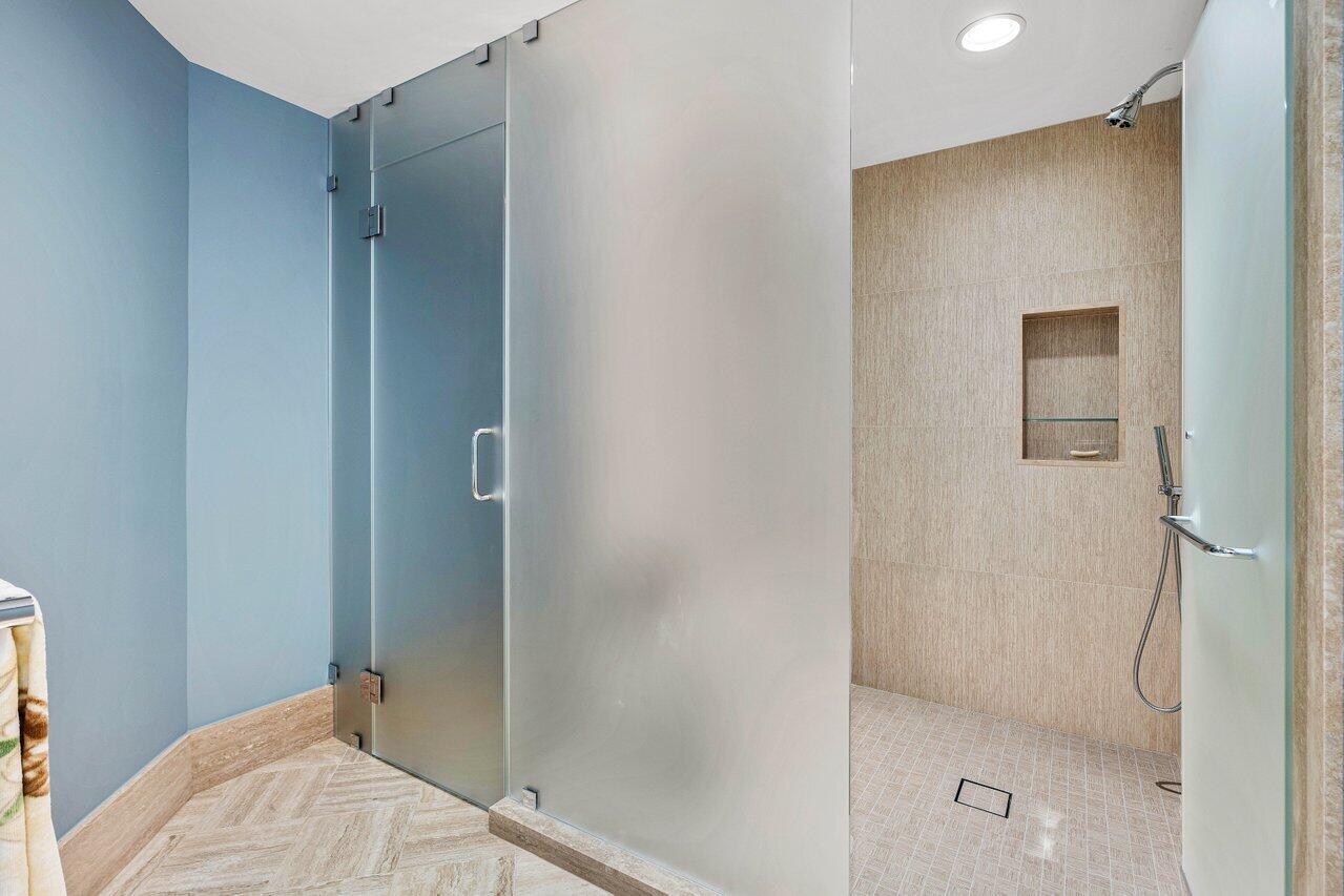 3001 Southeast Island Point Lane, Unit 12 Stuart, FL 34996 - Photo 28 of 44 a bathroom with a shower and toilet