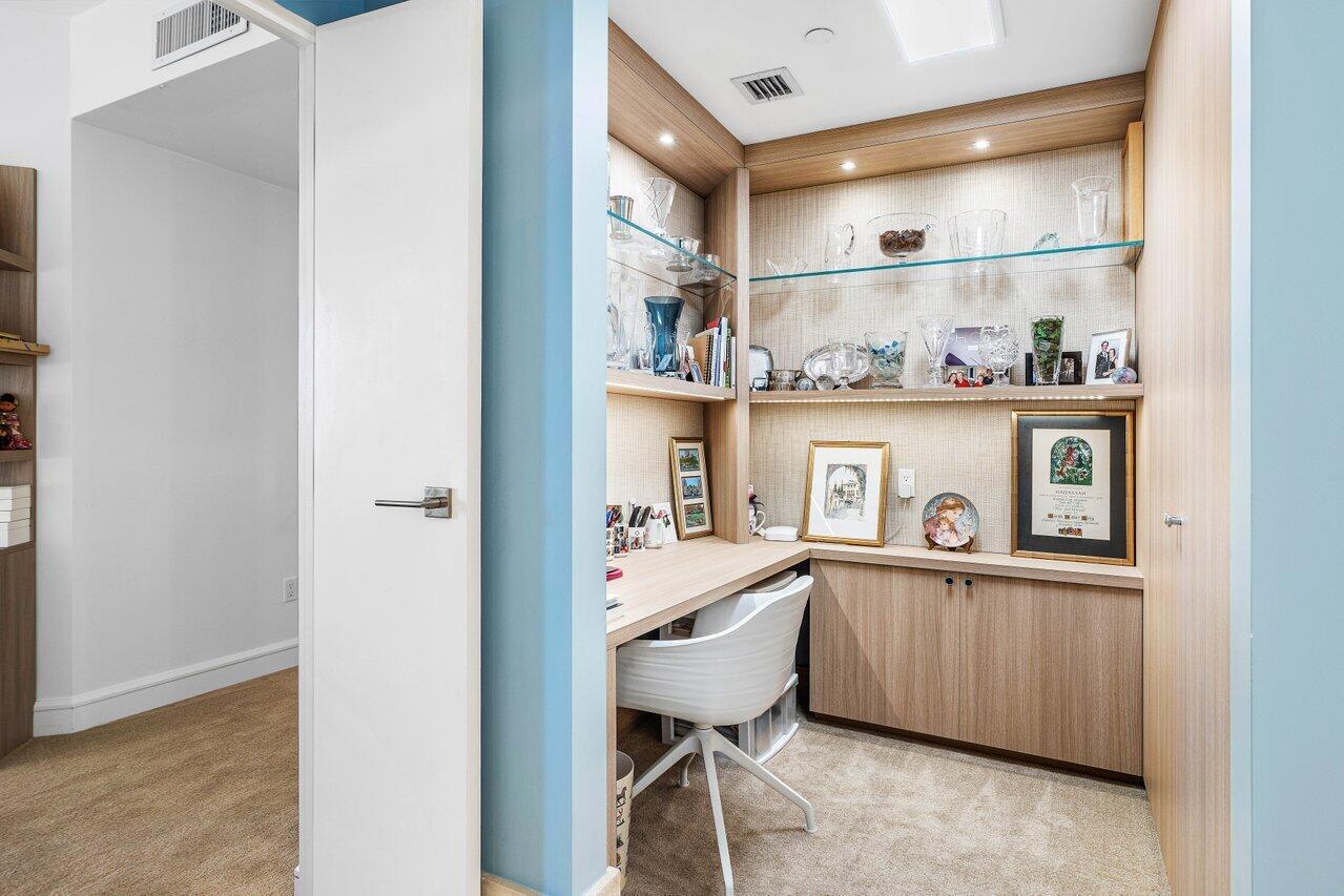 3001 Southeast Island Point Lane, Unit 12 Stuart, FL 34996 - Photo 29 of 44 a kitchen with stainless steel appliances granite countertop a sink and cabinets