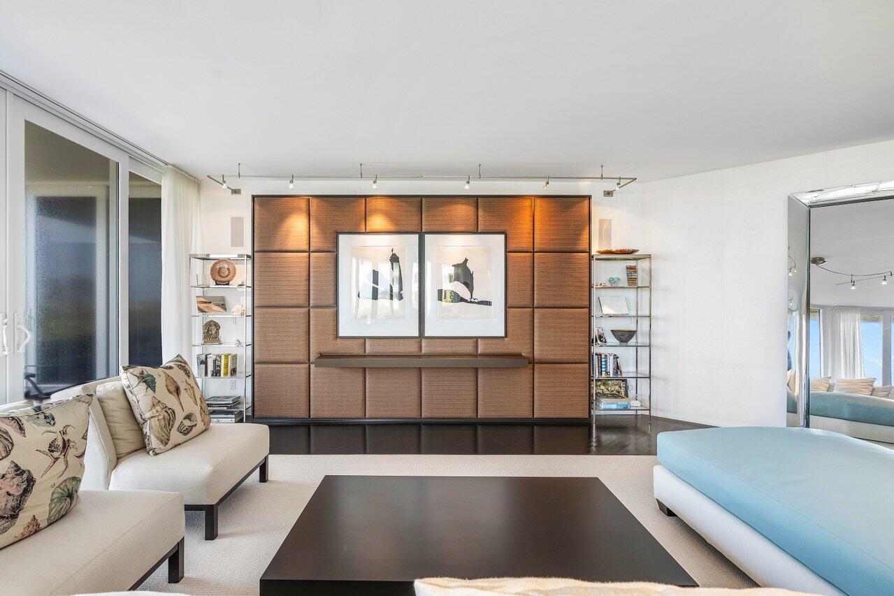 3001 Southeast Island Point Lane, Unit 12 Stuart, FL 34996 - Photo 4 of 44 a living room with furniture a rug and white walls