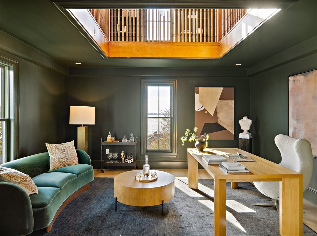 9 Little Nahant Road Nahant, MA 01908 - Photo 34 of 41 a living room with furniture a rug and a chandelier