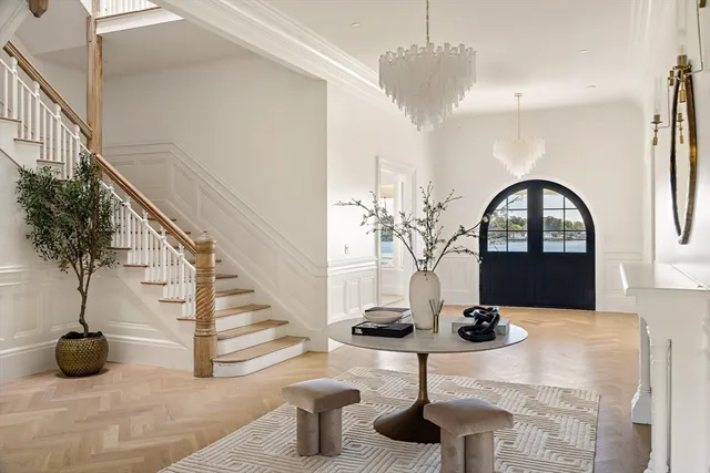 a dining room with furniture and wooden floor