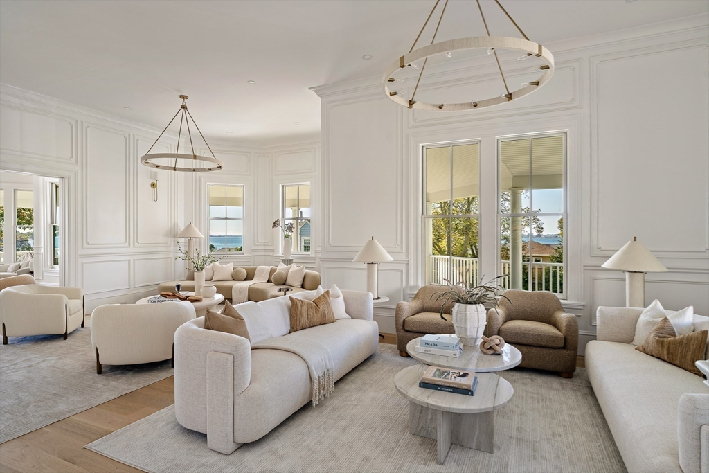 9 Little Nahant Road Nahant, MA 01908 - Photo 9 of 41 a living room with furniture a chandelier and a window