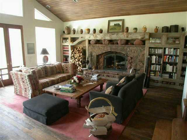 2165 Maroon Creek Road, Unit ROAD Aspen, CO 81611 - Photo 1 of 6 a living room with furniture and a fireplace