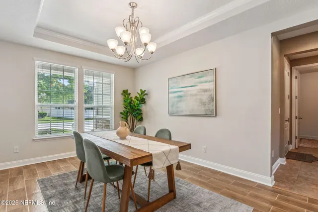 a view of a dining room with furniture window and outside view