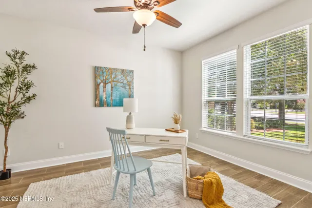 a bathroom with a granite countertop sink toilet and mirror