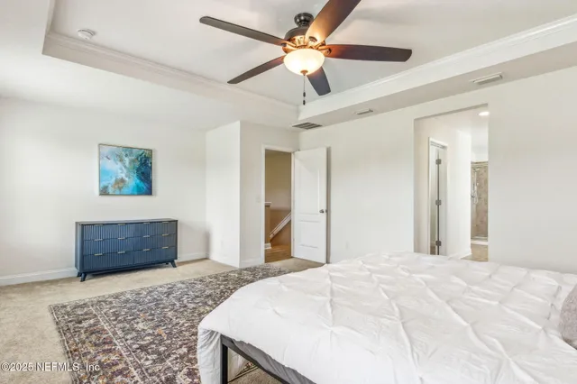 a spacious bathroom with a double vanity sink a mirror and a bathtub