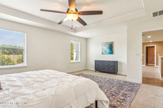 a bathroom with a shower and a window