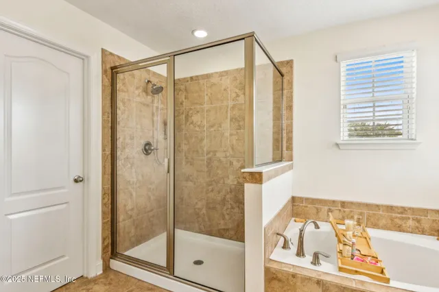 a view of a livingroom with lounge chair and a window