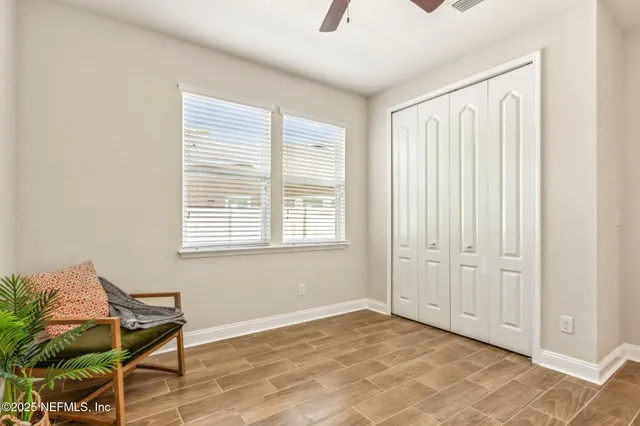 a white toilet sitting next to a bath tub
