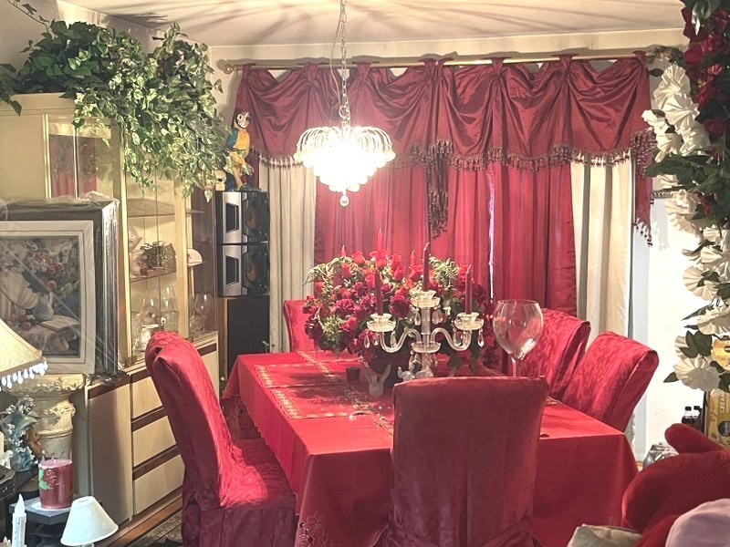 598 Miner Drive Bolingbrook, IL 60440 - Photo 4 of 13 a view of a dining room with furniture and chandelier
