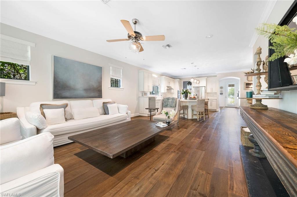 16359 Halberry Lane Naples, FL 34110 - Photo 11 of 30 a living room with furniture and a flat screen tv