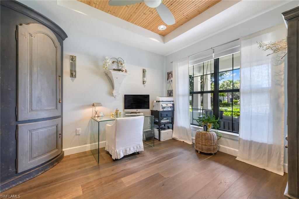 16359 Halberry Lane Naples, FL 34110 - Photo 13 of 30 a view of a livingroom with workspace and a window