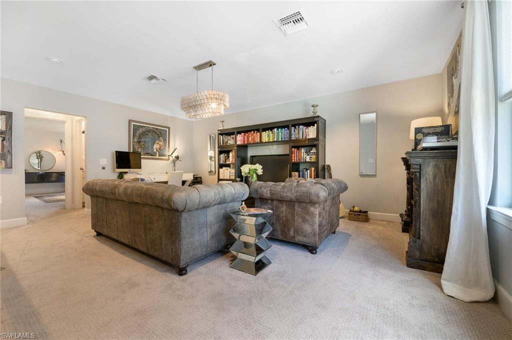 16359 Halberry Lane Naples, FL 34110 - Photo 15 of 30 a living room with furniture and a chandelier