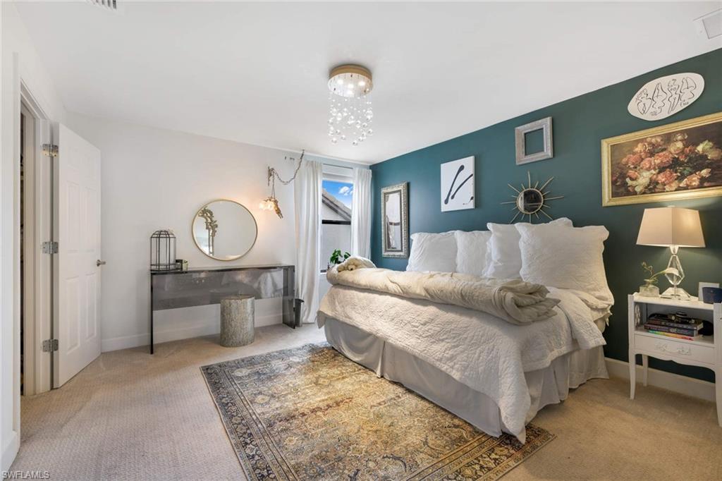 16359 Halberry Lane Naples, FL 34110 - Photo 19 of 30 a living room with furniture and a table