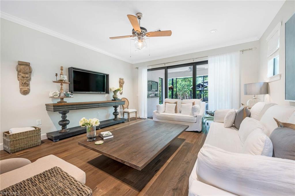 16359 Halberry Lane Naples, FL 34110 - Photo 10 of 30 a living room with furniture and a flat screen tv