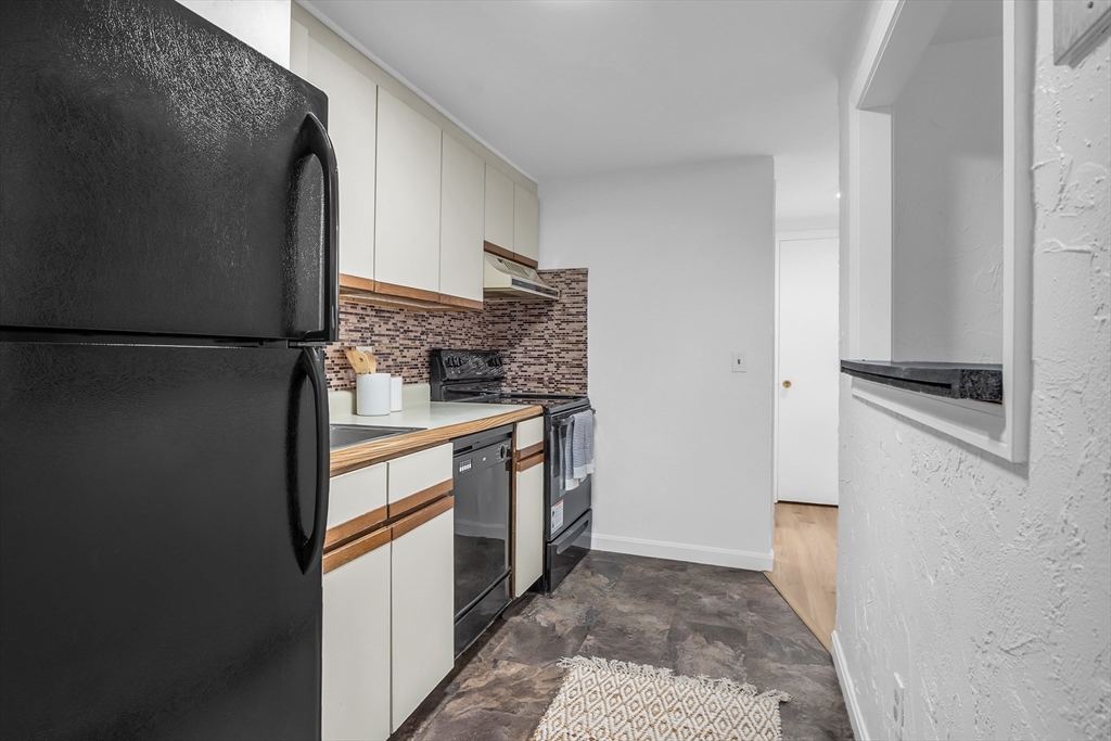 208 Swanson Road, Unit 526 Boxborough, MA 01719 - Photo 11 of 23 a kitchen with stainless steel appliances a refrigerator and a stove
