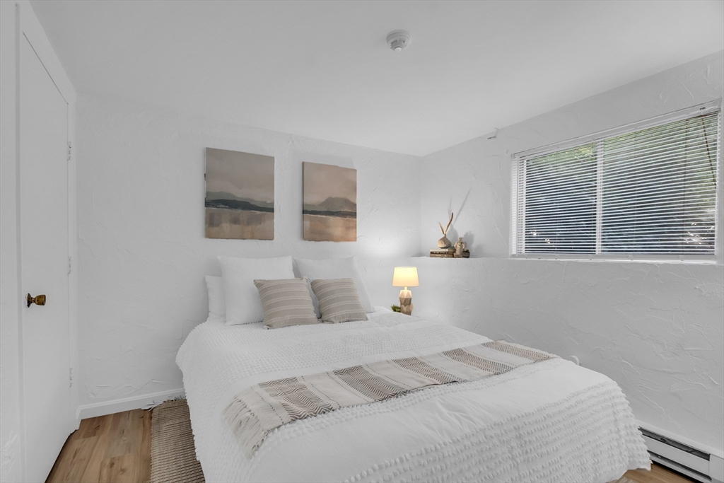 208 Swanson Road, Unit 526 Boxborough, MA 01719 - Photo 14 of 23 a bedroom with a bed and a window