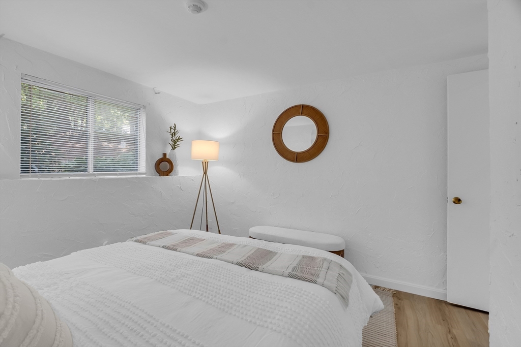 208 Swanson Road, Unit 526 Boxborough, MA 01719 - Photo 15 of 23 a bedroom with a bed and a window