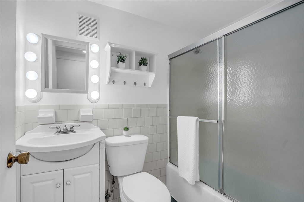208 Swanson Road, Unit 526 Boxborough, MA 01719 - Photo 18 of 23 a bathroom with a sink toilet and shower