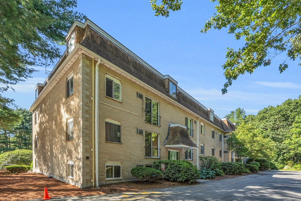 208 Swanson Road, Unit 526 Boxborough, MA 01719 - Photo 20 of 23 a front view of a house with a yard